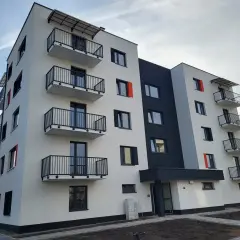 Nowe osiedle Sosnowiec: nowoczesny blok z balkonami i czarno-białą elewacją.