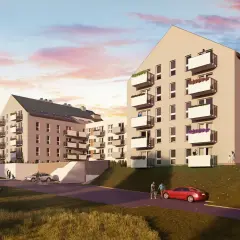 Nowoczesne apartamenty Królewskie Tarasy Wieliczka z balkonami i zielenią. Dzieci puszczają latawiec na trawiastym zboczu.