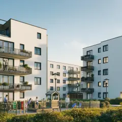 Słoneczne miasteczko z nowoczesnymi blokami mieszkalnymi, balkonami pełnymi zieleni i placem zabaw, gdzie bawią się dzieci.