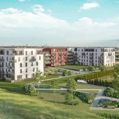 Nowoczesne budynki mieszkalne osiedle Sfera z zielonymi terenami rekreacyjnymi i widokiem na panoramę miasta.