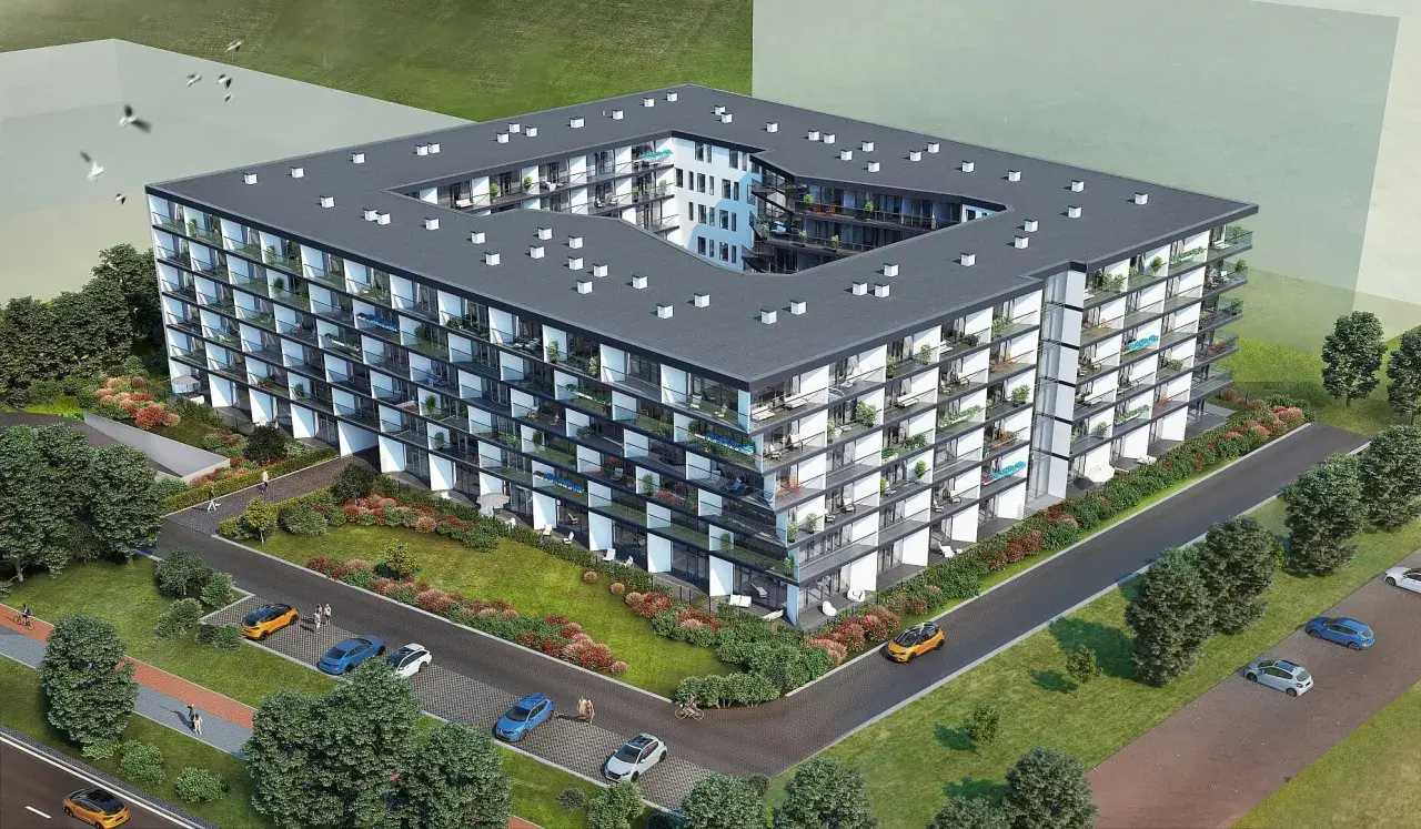 Nowoczesny budynek mieszkalny Chodźki Residence z licznymi balkonami i zielenią wokół.