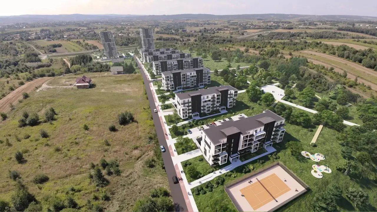 Nowoczesne budynki mieszkalne osiedle Carpatia otoczone zielenią, z kortem tenisowym i placem zabaw.